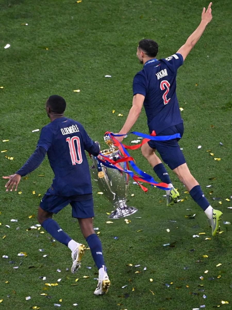 دوري أبطال أوروبا UEFA Champions League - باريس سان جيرمان PSG - إنتر ميلان Inter Milan - لويس إنريكي Luis Enrique - أشرف حكيمي Achraf Hakimi - دزيريه دووي Desire Doue - خفيشا كفاراتسخيليا Khvicha Kvaratskhelia - سيني مايوولو Senny Mayulu - ناصر الخليفي Nasser Al-Khelaifi - محمد رمضان Mohamed Ramadan - الشيخة المياسة بنت حمد آل ثاني Al Mayassa bint Hamad Al-Thani - الأمير تميم بن حمد آل ثاني Tamim bin Hamad Al Thani - لويس إنريكي مع ابنته - مشجعو PSG - صورة جماعية لفريق باريس سان جيرمان - احتفالات باريس بلقب دوري الأبطال - مدرب برشلونة السابق - ملعب أليانز أرينا Allianz Arena - مدينة ميونيخ Munich - نيمار Neymar - ليونيل ميسي Lionel Messi - كيليان مبابي Kylian Mbappé - ديفيد بيكهام David Beckham - تاريخ باريس سان جيرمان في أوروبا - أول لقب أوروبي لـ PSG - تصريحات لويس إنريكي بعد التتويج - احتفالات جماهير باريس - صورة نادرة للويس إنريكي وابنته