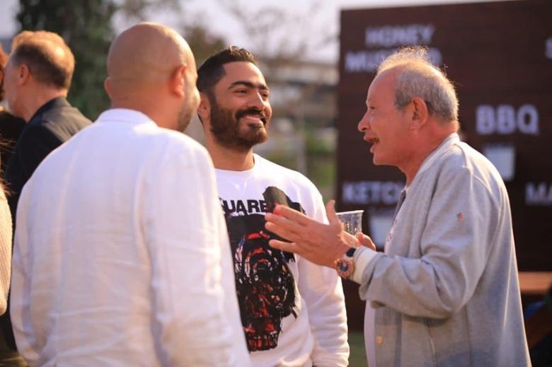 تامر حسني مع نجيب ساويرس من حفل الإفتتاح