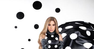 نجوى كرم تظهر بفستان بولكا دوتس من تصميم أحمد حلاوي