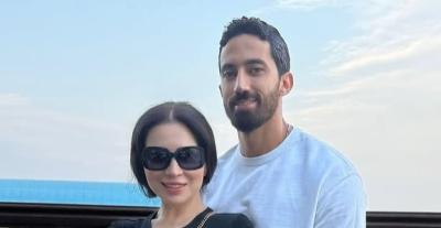 مي عز الدين وزوجها