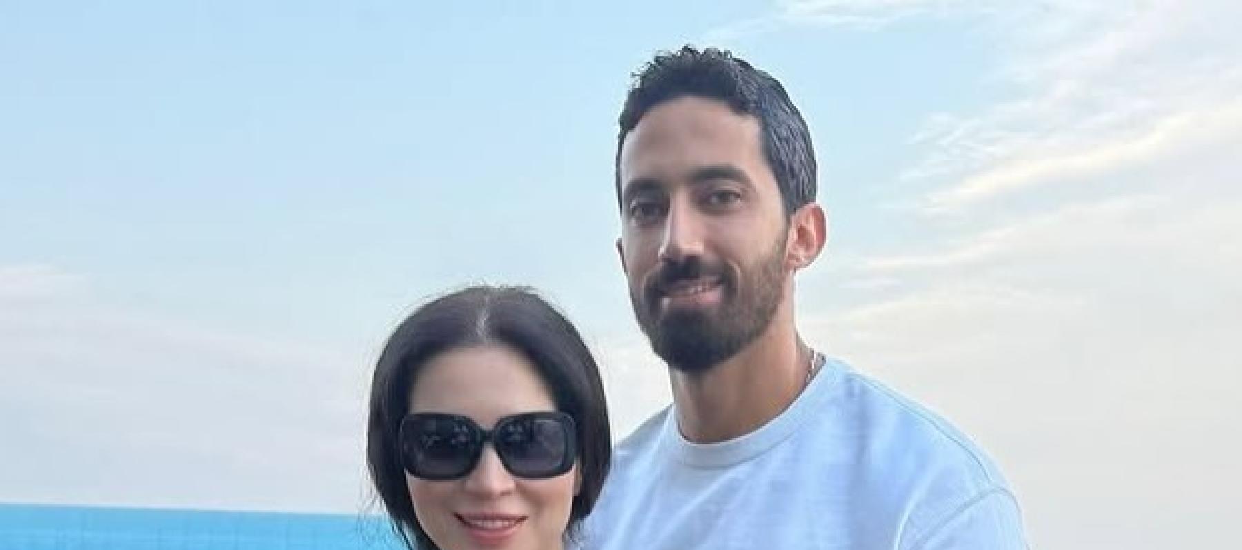 مي عز الدين وزوجها