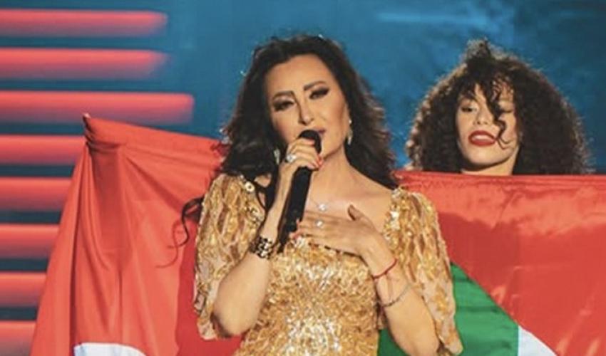 لطيفة بالعلم التونسي والفلسطيني