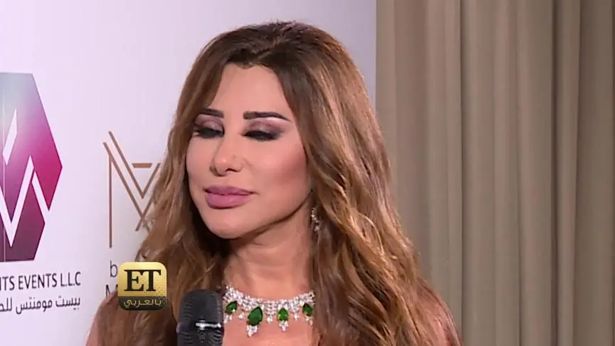 نجوى كرم بالأبيض 